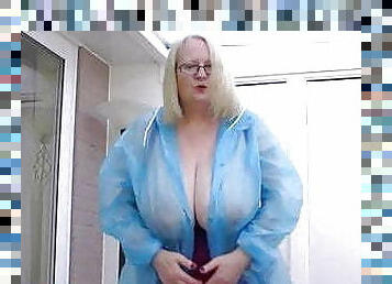 Sallys amazing tits in a PVC raincoat