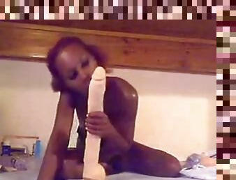 Naughty black babe on webcam fucks herself with huge dildo and teasing