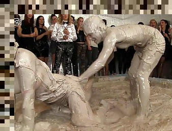 Mud wrestling between two fierce and hot bombshells