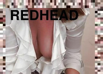 Big breasted redhead has stunning cleavage