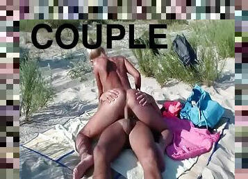 A couple gets naked at the beach and fucks in the sand