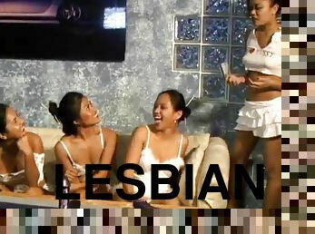 A few horny lesbians play with a strapon in group sex scene