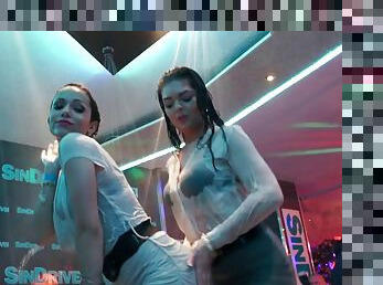 Crazy party girls getting wet while dancing on stage in a shower