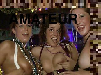 A few slutty chicks show their tits and butts in a club