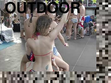 Tattooed pornstars in bikini dancing wildly in a party outdoor in reality shoot