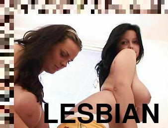 Two well-endowed lesbians play with each other's awesome tits