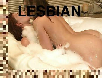 Lesbian pornstar lovers having an erotic bath in a tub