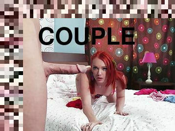 A guy holds this hot redhead in the air and fucks her hard