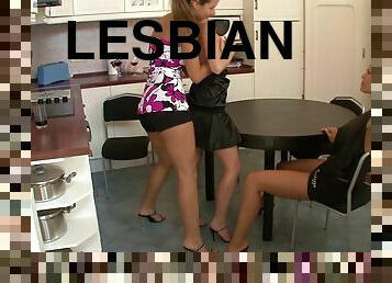 Lesbians in miniskirts enjoys licking and fingering in the kitchen