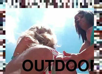Outdoor hot lesbo scene with two girls in swim suits