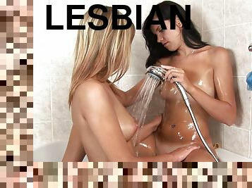 Gorgeous teen lesbians have some wet fun in the bath