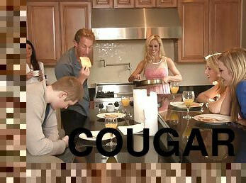 Friendly cougars share a guy's hard cock during a threesome