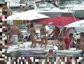 Some slutty chicks flash their nude bodies during a beach party