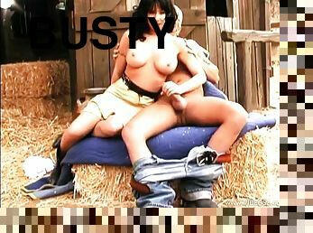 Busty brunette Kelly Erikson enjoys riding a wang in a barn