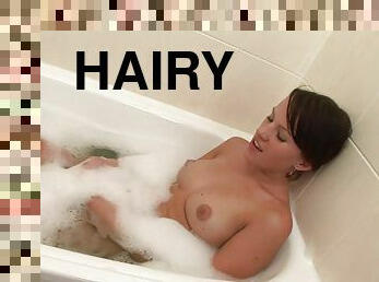 Sizzling Brunette With An Awesome Body Playing With Her Hairy Pussy In The Bath