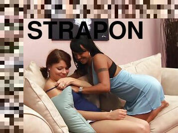 Two horny Latinas enjoy playing with a strapon in hardcore lesbian vid
