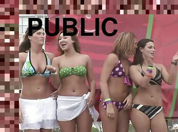 Some hot chicks in bikinis shake their butts in public