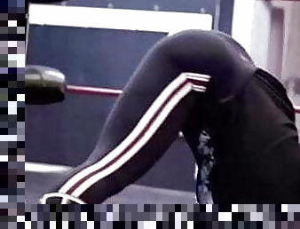 Trish Stratus doing yoga in tight black pants