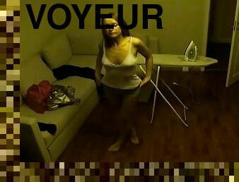 A voyeur video with a nice chick changing her clothes