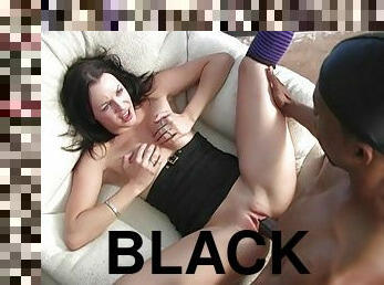 A slim brunette in knee socks takes big black cock in her pink pussy