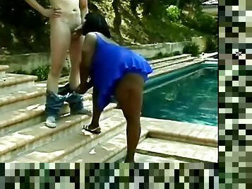 Very fat Black chick gives a blowjob to White guy outdoors