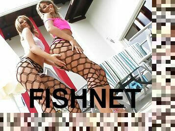 Bootylicious babes in fishnets have threesome sex on a sofa