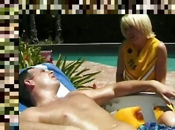 Slim blonde in cheerleader uniform fucks by the pool