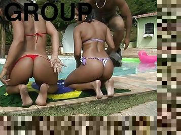 Two sizzling Brazilian chicks have foursome sex by the pool