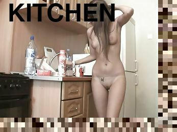 Melena enjoys playing with her smooth pussy in the kitchen