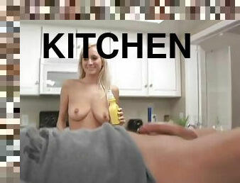 Blonde hottie gives a handjob to a plumber in the kitchen