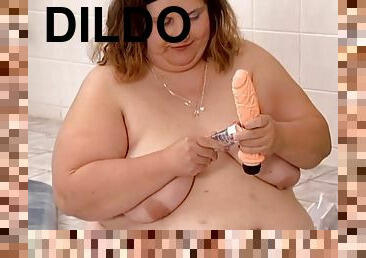 BBW Kristina enjoys playing with a dildo near a jacuzzi