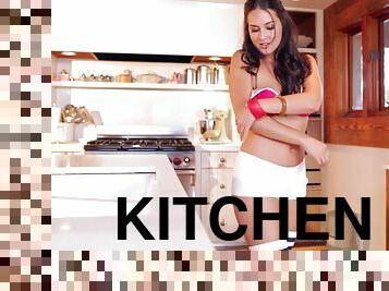 Curvy hottie Winona West enjoys posing nude in the kitchen