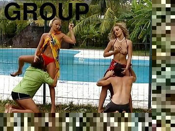 Two hot blondes enjoy foursome banging on the poolside