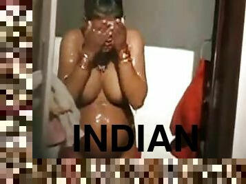 Pregnant Indian chick with big boobs takes a shower