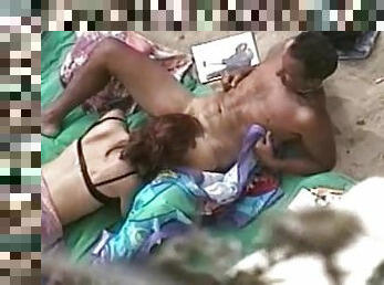 Insatiable redhead milf sucks a hard cock on a beach