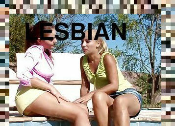Two gorgeous cuties play lesbian games on the poolside
