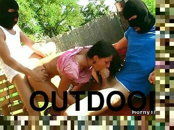 Gorgeous Brunette Stops Reading To Fuck Two Masked Guys Outdoors