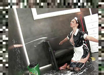 Latex maid sucks the big dildo and gets covered in sticky fake cum