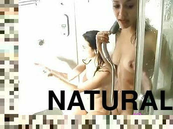 Beautiful brunette with big natural tits taking a shower