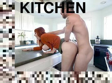 Redhead Lauren Phillips gets to suck a big dick in the kitchen