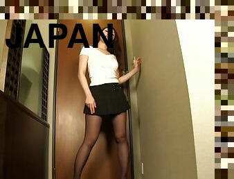 Mini-skirt clad Japanese girl with a hot ass touching her sexy body