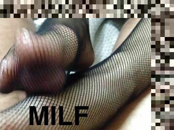 Footjob inside fishnets