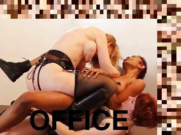 In the office hot pussies fuck each other with strap-ons