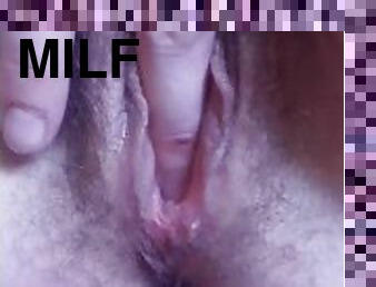MILF plays with her pussy up close