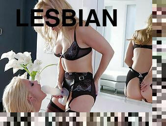 Lesbian blonde has her anal spooked with a strap on dildo