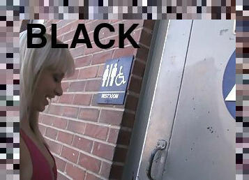 Blonde Hottie Stroking Black Cock in a Bathroom Gloryhole