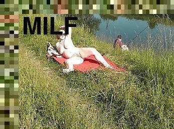 Wild Beach. Sexy Milf Platinum Naked Sunbathing On River Bank, Random Fisherman Guy Watches. Naked In Public. Nude Beach