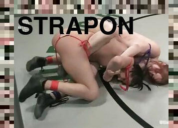 Calico and Naudia Nyce play with a strapon after fighting on tatami