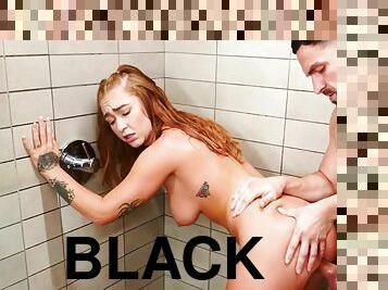 Redhead minx Callie Black pleasures bearded dude in the bathroom