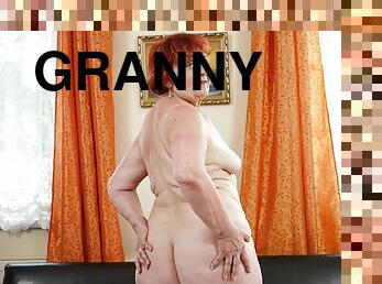 Redhead granny with natural boobs gets boned in the living room